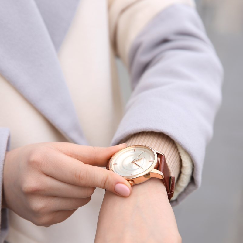 Checking the time on a wristwatch