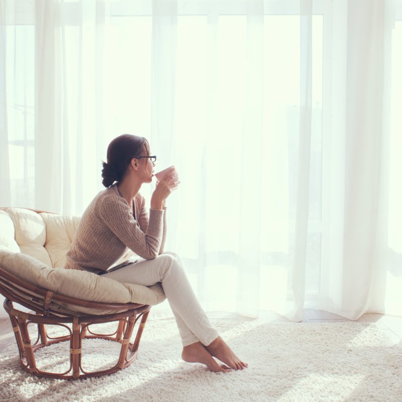 Guest with morning coffee in a hotel room