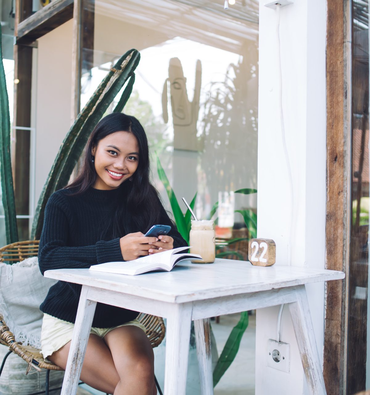 Guest planning her stay on a sunny terrace